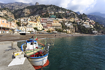 Fishing boat at quayside and Positano town, Costiera Amalfitana (Amalfi Coast), UNESCO World Heritage Site, Campania, Italy, Europe 