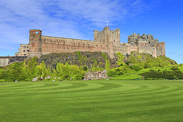 Bamburgh Castle under a blue summer sky, Bamburgh, Northumberland, England, United Kingdom, Europe