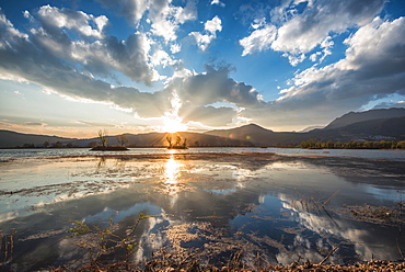 Cloud reflections at a lake in Lijiang, Yunnan, China, Asia 