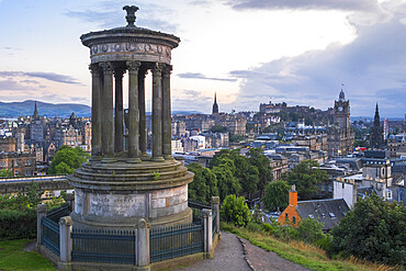 The Dugald Stewart monument on Calton Hill, Edinburgh with the city skyline in the background, Edinburgh, Scotland, United Kingdom, Europe