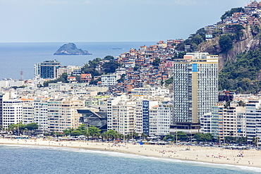 Elevated view of Copacabana Beach, apartment blocks and the Pavao Pavaozinhao favela slum, Rio de Janeiro, Brazil, South America