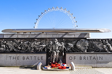 The RAF Battle of Britain Memorial Monument by British sculptor Paul Day, with the London Eye behind, London, England, United Kingdom, Europe