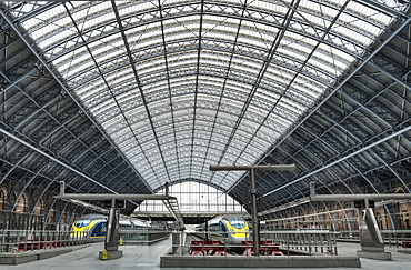 Eurostar Trains waiting on platforms in the 19th century wrought iron interior of St. Pancras Railway station, London, England, United Kingdom, Europe