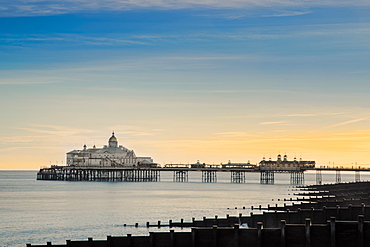 View along the beach to Eastbourne pleasure pier, Eastbourne, East Sussex, England, United Kingdom, Europe