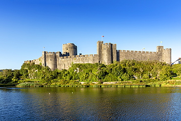 Medieval walls of Pembroke Castle (Castell Penfro), birthplace of King Henry VII of England, Pembroke, Pembrokeshire, Wales, United Kingdom, Europe