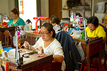 Goldsmiths working in a jewellery factory in Northern Thailand, Southeast Asia, Asia