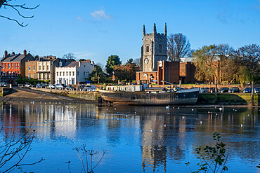 All Saints Church, Isleworth town centre, seen from the Thames Path in Kew in autumn, River Thames, London, England, United Kingdom, Europe