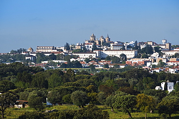 View of Evora city with cork oak fields in the foreground, Evora, Alentejo, Portugal, Europe