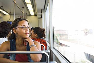 African woman riding on train