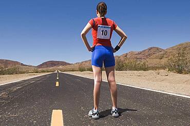 Mixed Race female runner on road