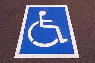 Handicapped symbol painted on pavement