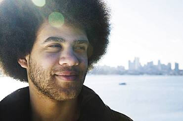 African man in front of city skyline