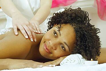 African woman receiving massage