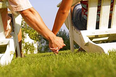 Close up of couple holding hands