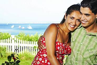 Young couple hugging outdoors