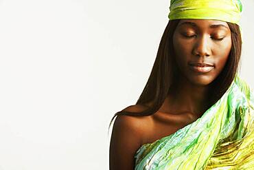 Studio shot of African woman with eyes closed