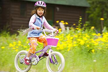 Portrait of girl riding bike