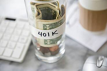 Close up of savings cup on office desk