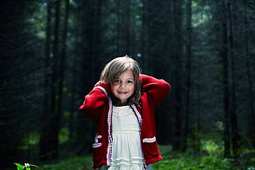 Caucasian girl smiling in forest