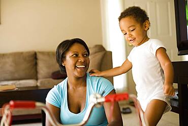 Mother and son playing in living room