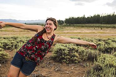 Caucasian woman posing in remote field