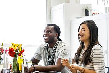 Couple smiling at dining room table