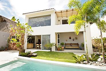 Swimming pool in backyard of modern home