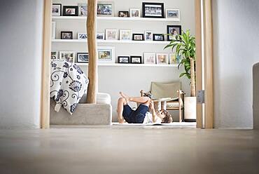 Hispanic boy playing on living room floor