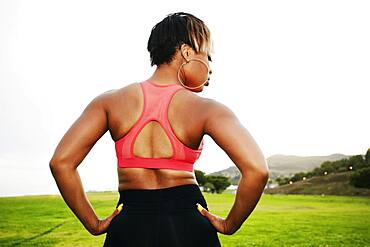 Black woman standing in field