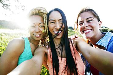 Friends taking selfie outdoors