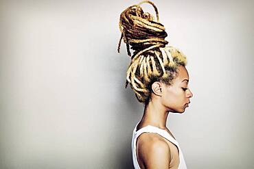 Black woman with dreadlocks bun