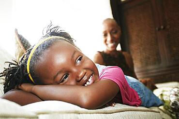 Black girl laying on sofa