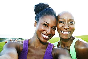 Women smiling in park