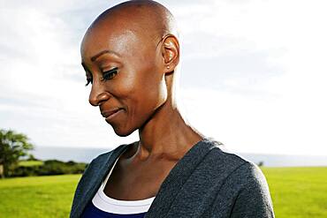 African American woman smiling in park