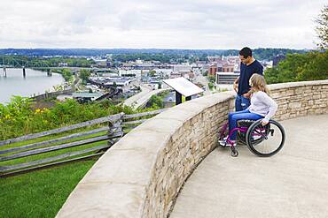 Couple admiring view of Columbus cityscape, Ohio, United States