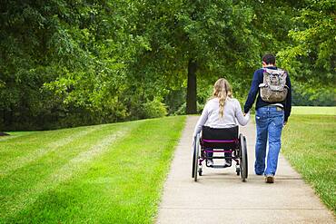 Couple holding hands in park