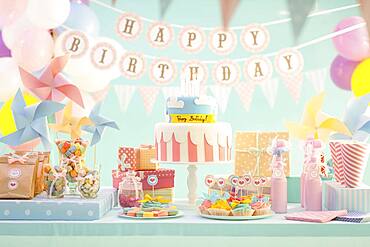 Cake, candy and gifts at birthday party