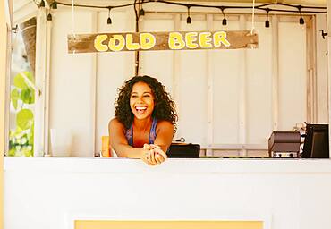 Woman leaning in beach shack