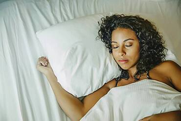 Close up of woman sleeping in bed