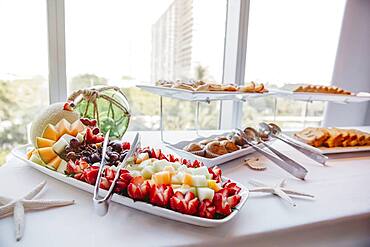 Close up of fruit and muffins at breakfast buffet