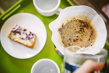 Caucasian man pouring breakfast coffee