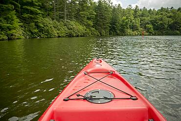 Canoe floating on remote lake