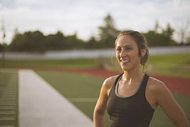Caucasian athlete standing on sports field