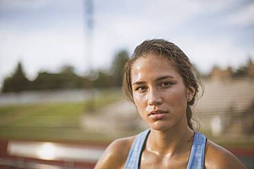 Mixed race athlete on sports field