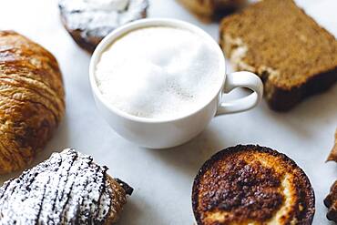 Close up of variety of pastries and coffee