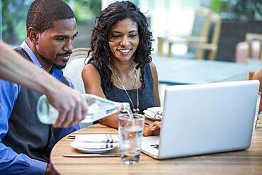 Business people working at lunch in cafe