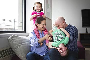 Family playing in living room