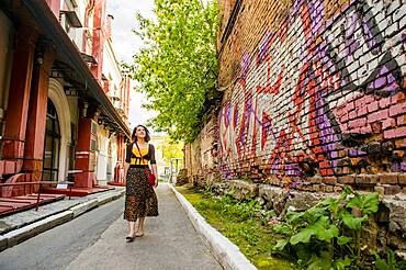 Caucasian woman walking in city street