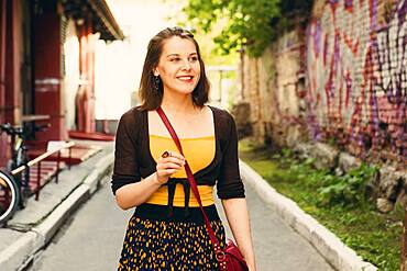 Caucasian woman walking in city street