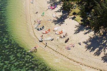 Aerial view of kitesurfers on beach